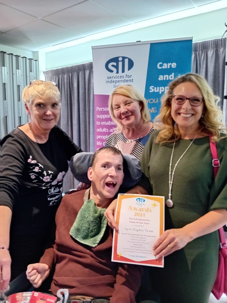 Dave Hughes and support team winning an award at SIL AGM 2024