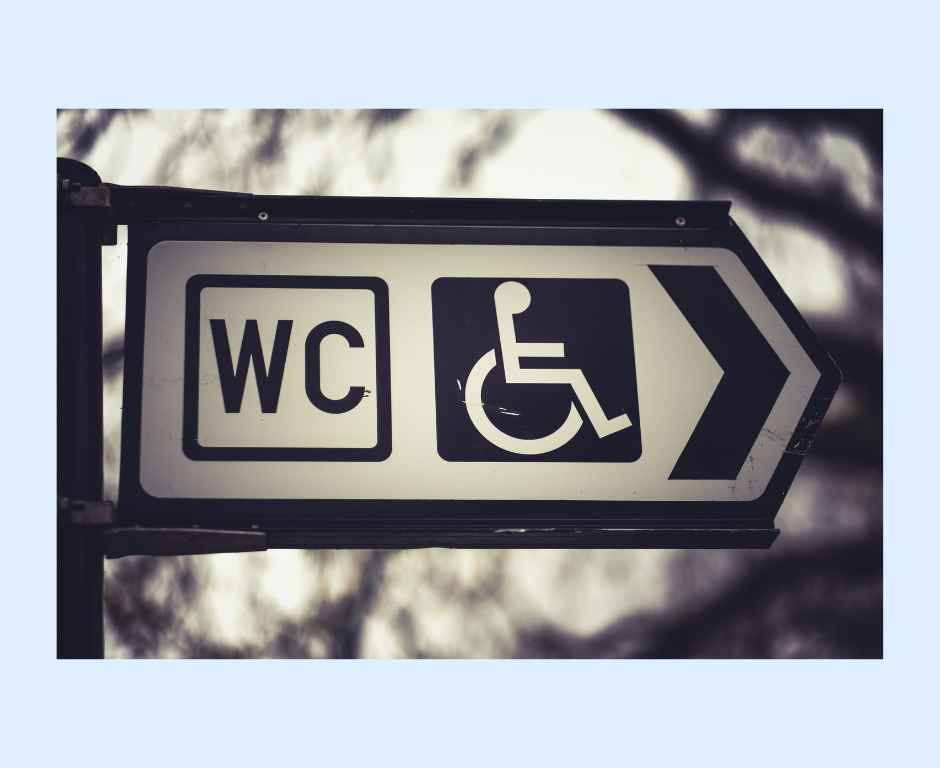black and white sign for disability toilet