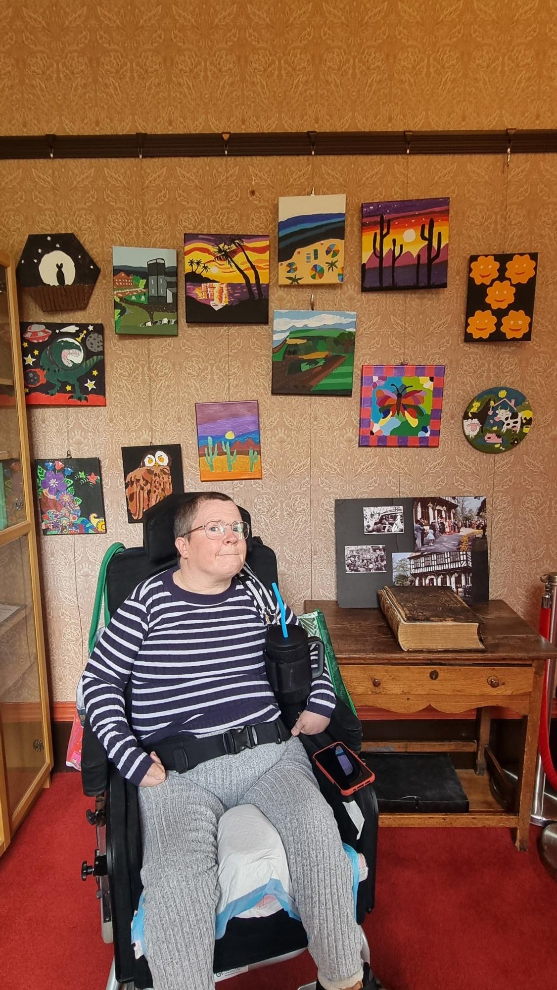 Lindsey Muckles with her original art pieces in her solo art exhibition at Grange Court